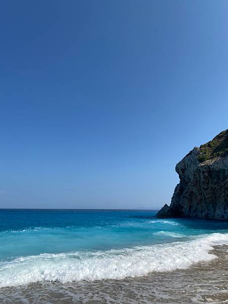 istock Clear turquoise waves hitting the shore at Egremni beach in Lefkada, Greece 2223460076