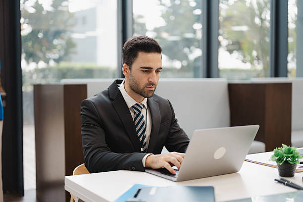istock Caucasian businessman working in office 2223469421