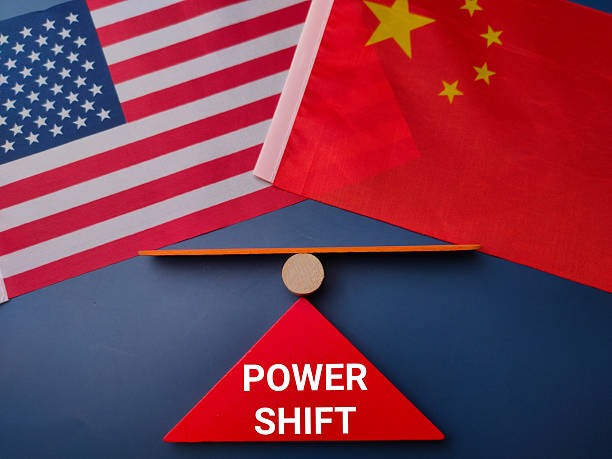 istock Us and china flag with the word POWER SHIFT on a blue background 2223469909
