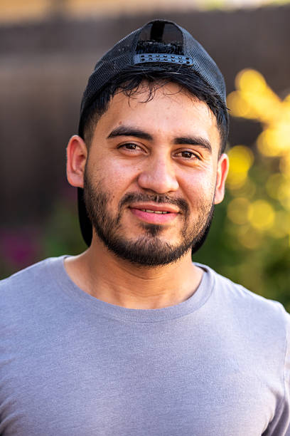 istock Headshot of a  smiling young  Hispanic man posing looking at camera 2223471884
