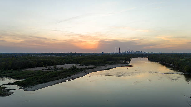 istock Beautiful sunset over a river with a city in the background 2223477778