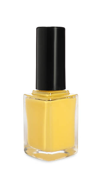 istock Yellow nail polish in bottle isolated on white 2223483955