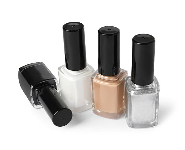 istock Beautiful nail polishes in bottles isolated on white 2223483968
