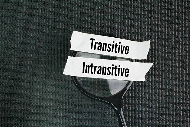 istock A magnifying glass with two words transitive and intransitive. Transitive verbs need a direct object to receive the action, while intransitive verbs do not. 2223483989