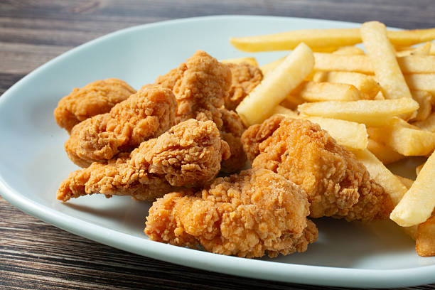 istock chicken nuggets, fries 2223493228