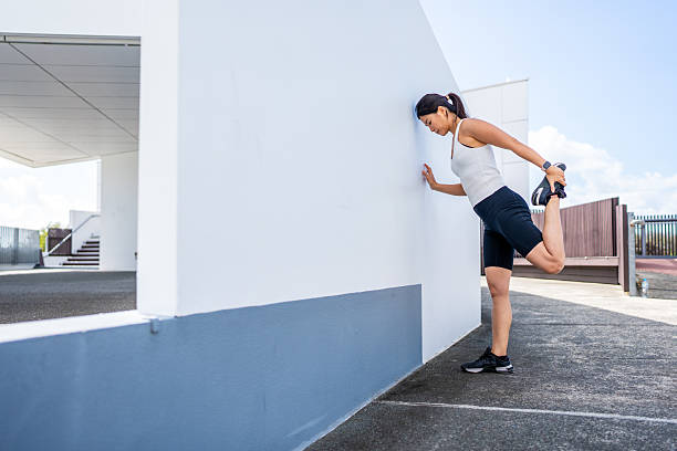 istock Asian Woman Stretching Outdoors Before Exercise 2223494675