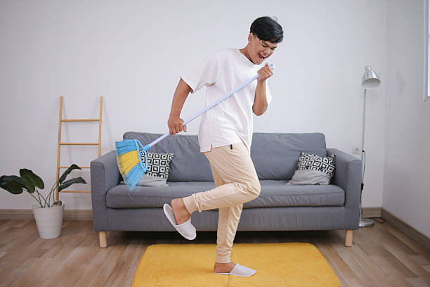 istock Man Singing During House Chores 2223495458