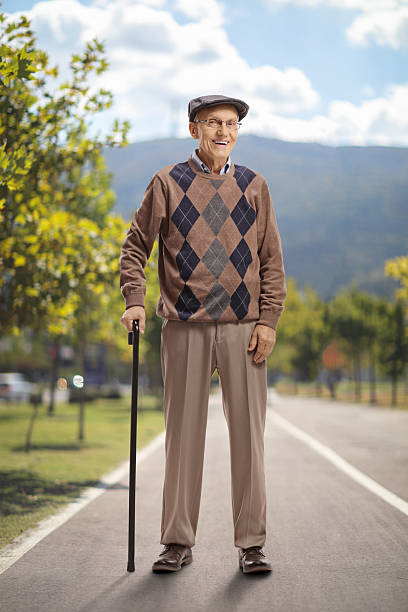 Senior man having chest pain while waiting on station.