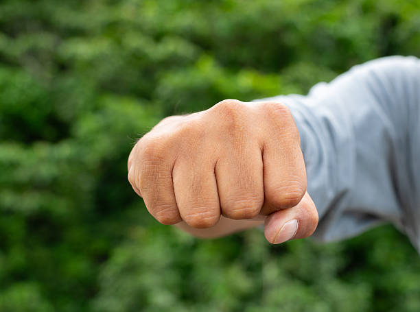 istock Male hand clenching a fist 2223502123