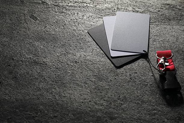 White balance calibration cards on grey background. Space for text