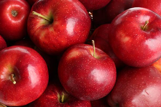 istock Fresh ripe red apples as background, top view 2223505114