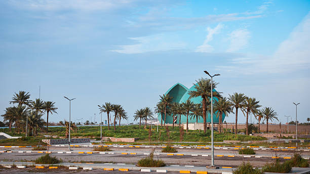 istock Exploring the serene landscape of Baghdad with palm trees and modern architecture 2223505392