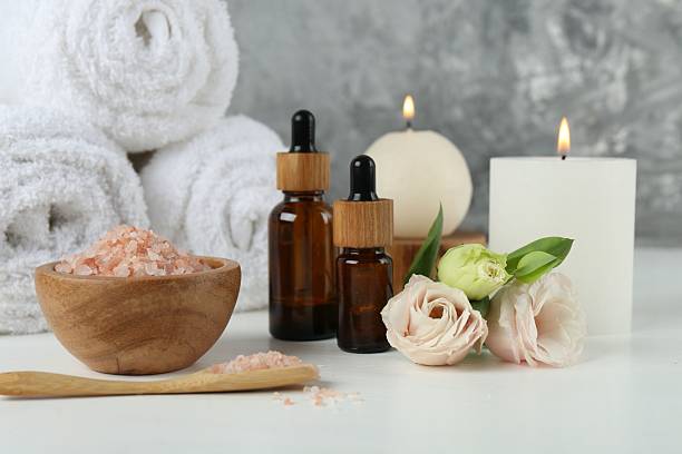 istock Spa composition with cosmetic products and towels on white table 2223505729