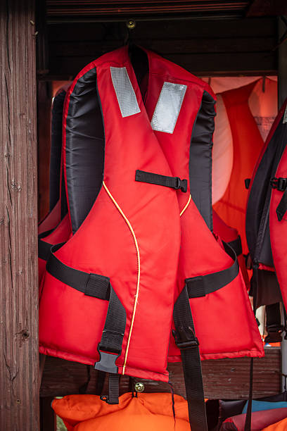 istock A bright red life jacket hangs neatly on a wooden wall 2223508658