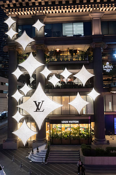 Bangkok, Thailand. March 19th 2025.Louis Vuitton designer fashion logo displayed on the flagship store near the EM District and Emporium Mall, a fashionable shopping district of Bangkok, Thailand.
