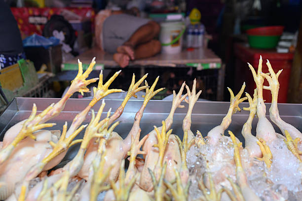 Fresh chickens feet on display at a stall in Khlong Toei Market, Bangkok.