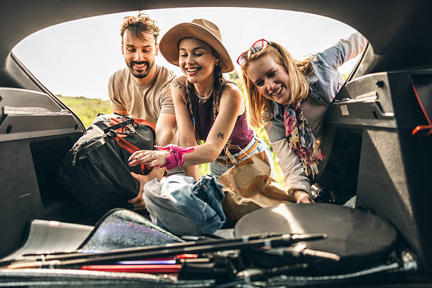 istock Friends Preparing Picnic From Stuffs From Car 2223511302