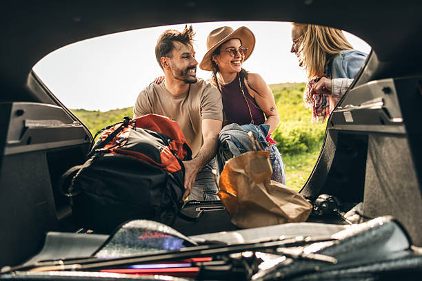 istock Friends Preparing Picnic From Stuffs From Car 2223511357