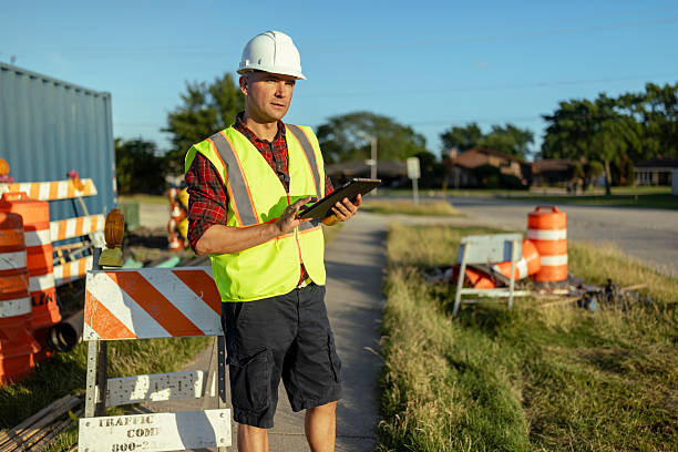istock Male engineer uses digital tablet to plan work in road construction area 2223513474