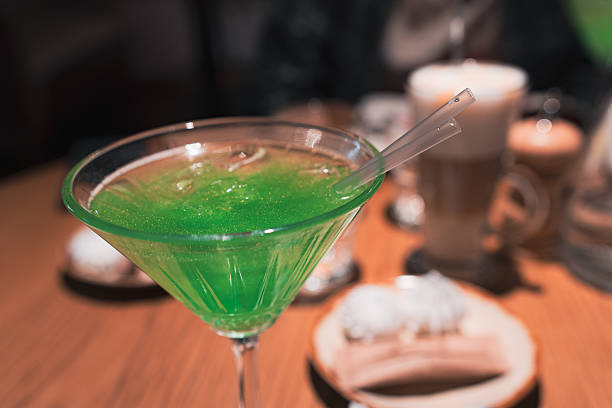 Green cocktail on a wooden table. High quality photo