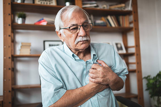 istock Senior man experiencing chest pain at home 2223515175