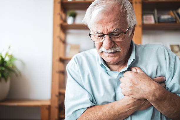 istock Senior man experiencing chest pain at home 2223515177