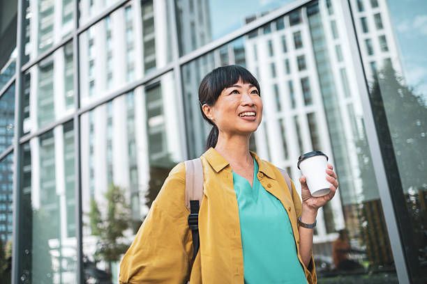 istock Smiling professional enjoying a coffee break outdoors 2223515272
