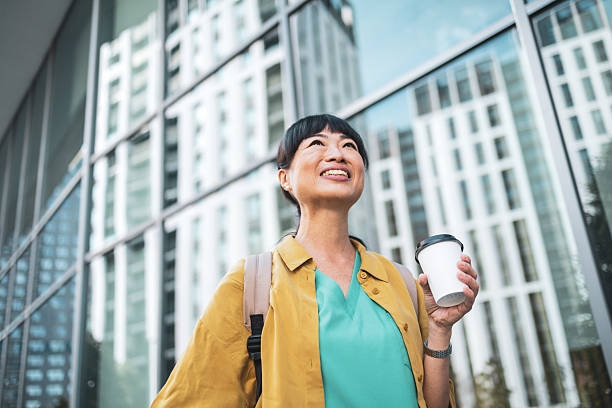 istock Confident professional woman enjoying coffee break 2223515275