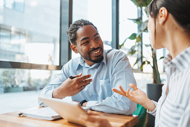 istock Two young professionals having a meeting in a modern office 2223515318
