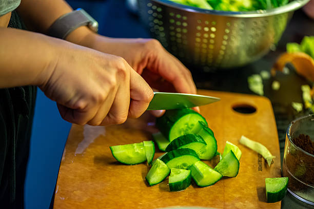 istock Woman Preparing Fresh Salad in the Kitchen 2223517963