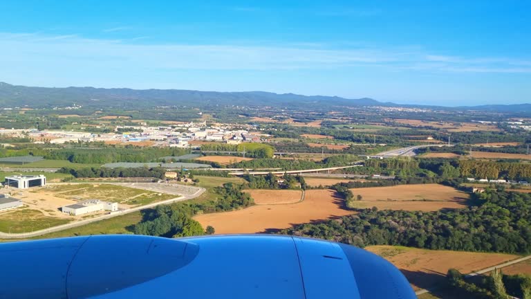 Scenic Aerial View of Countryside and Farmland from Airplane Window