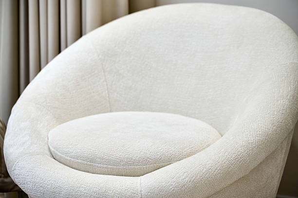 istock Cozy and stylish round white chair in a modern interior setting with soft lighting 2223518642