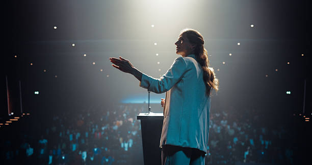 istock Beautiful Personal Growth Keynote Speaker Delivering a Motivational Speech on Stage, Hosting a Healthcare Seminar to Help Entrepreneurs Overcome Their Personal and Professional Challenges 2223523631
