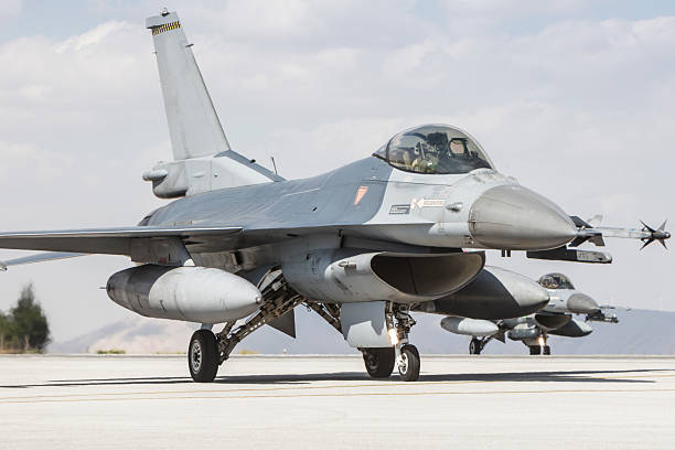 istock F-16 Fighting Falcon fighter plane on runway 2223524013