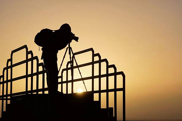 istock Photographer silhouette at sunset. 2223524131