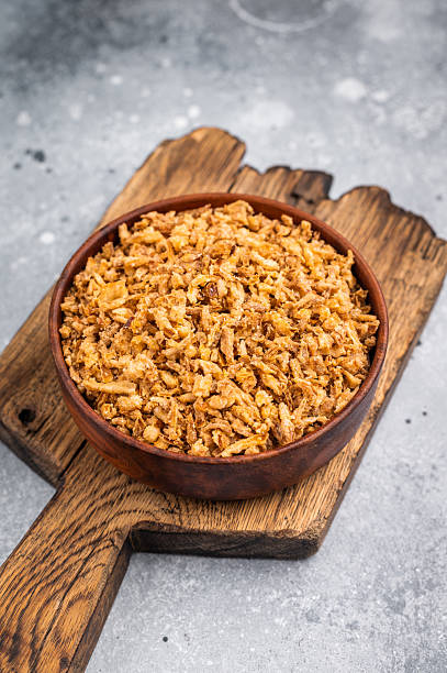 istock Crispy Fried Onion, Roasted dried Onions. white background. top view 2223524153