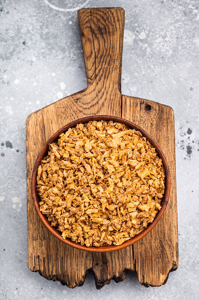 istock Crispy Fried Onion, Roasted dried Onions. white background. top view 2223524183