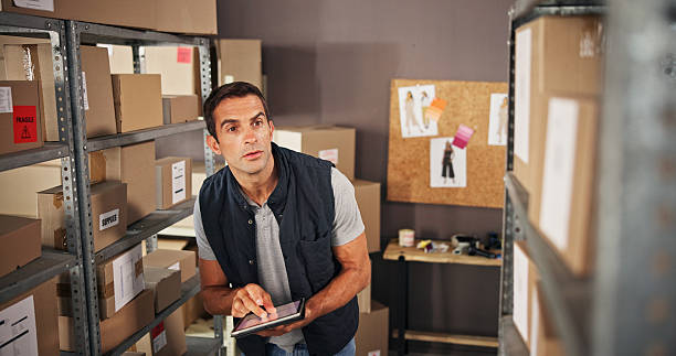 istock Warehouse, man and tablet for checklist, quality control and production order for logistics or shipping. Courier, technology and distribution for trade or factory, supply chain and ecommerce industry 2223526022