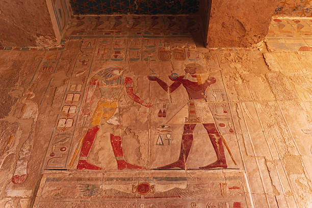 istock Ancient egyptian pharaoh receiving offerings in a colorful wall relief 2223526034