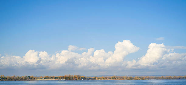 istock Banner. Beautiful blue sly with clouds 2223527864