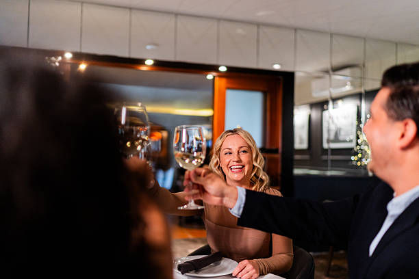 istock Friends toasting wine at restaurant 2223528653