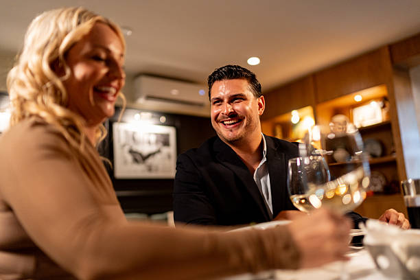 istock Couple talking and toasting wine at restaurant 2223529370