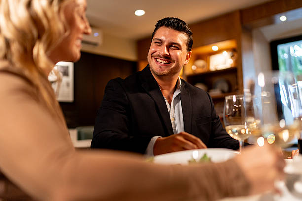 istock Couple talking and toasting wine at restaurant 2223529371