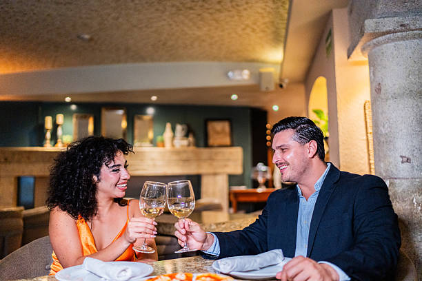 istock Couple talking and toasting wine at restaurant 2223530253