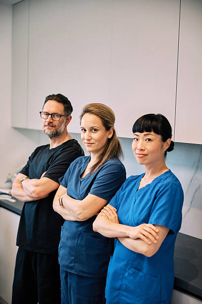 Confident Multicultural Dentists in Modern Clinic