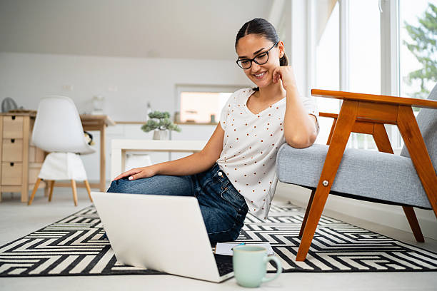 istock A young woman studies online from home, her eyes fixed on the laptop screen during an e-learning session. 2223535438