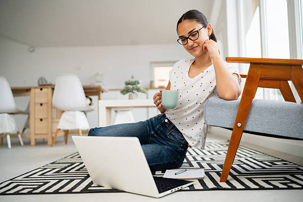 istock A young woman studies online from home, her eyes fixed on the laptop screen during an e-learning session. 2223535578