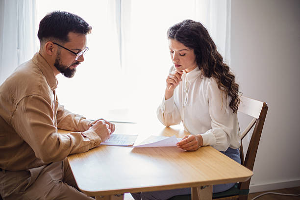 istock Financial advisor explaining contract to pensive woman during meeting 2223535627