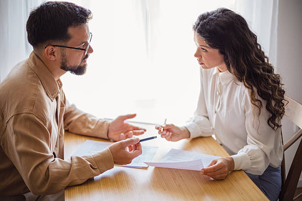 istock Business colleagues discussing contract terms at office table 2223535681