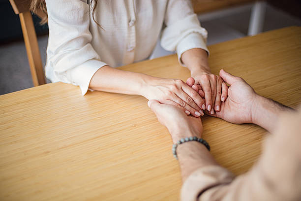 istock Couple holding hands showing support and love 2223535968